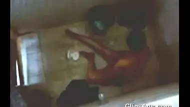 Indian Desi home nurse taking bath captured using hidden cam placed on roof .